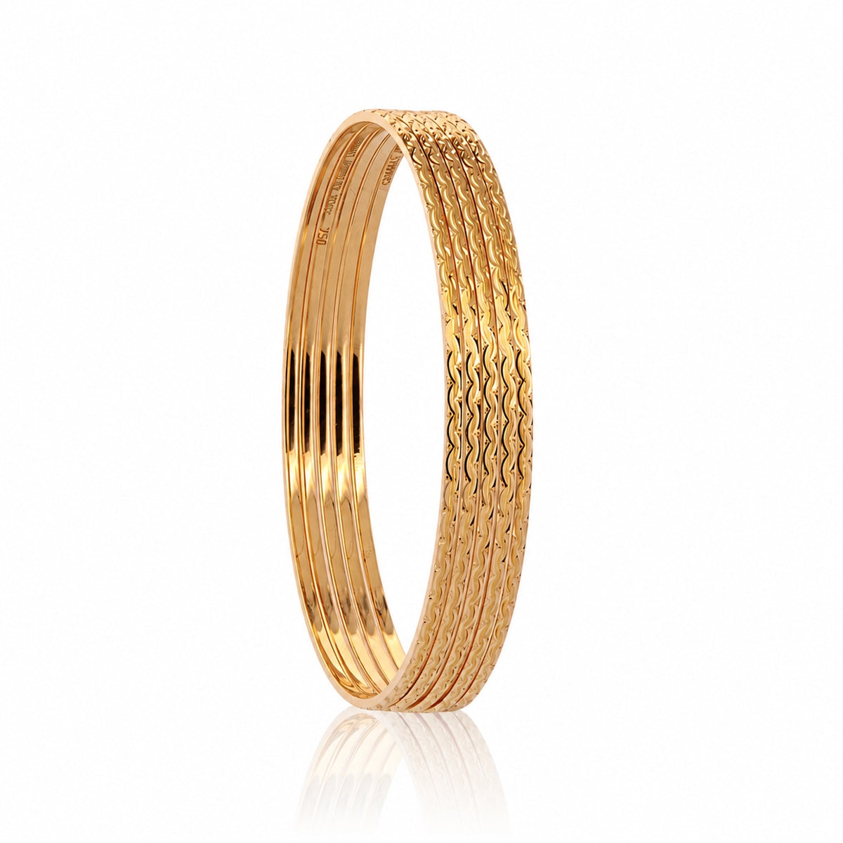 18K mermaid bangles angled view with textured outer edge