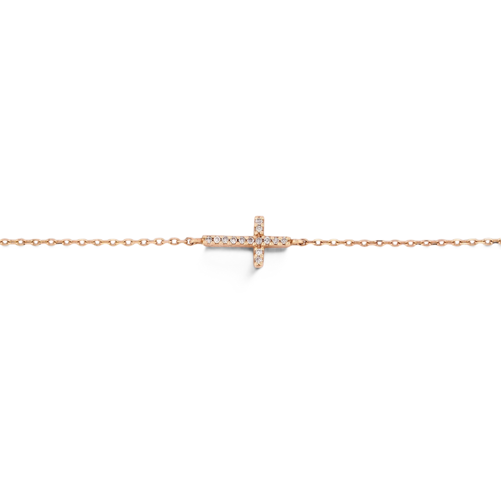 Gemmas Jewelry Edit Lucia Cross Bracelet with natural diamonds on a delicate 14k yellow gold bracelet, adjustable fit.