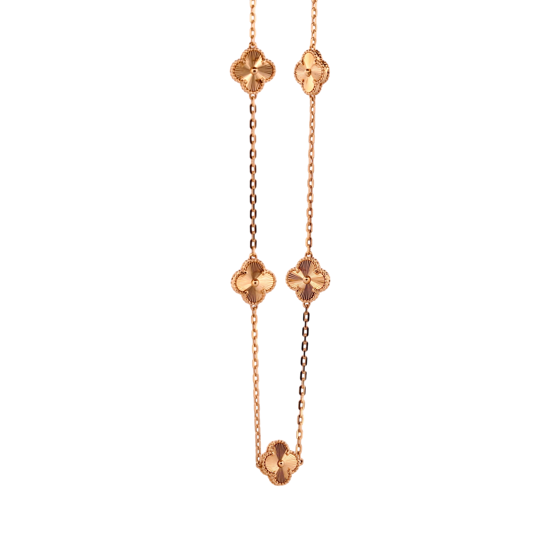 Gemmas Jewelry Edit yellow gold necklace with four clover charms featuring sunburst pattern detail.