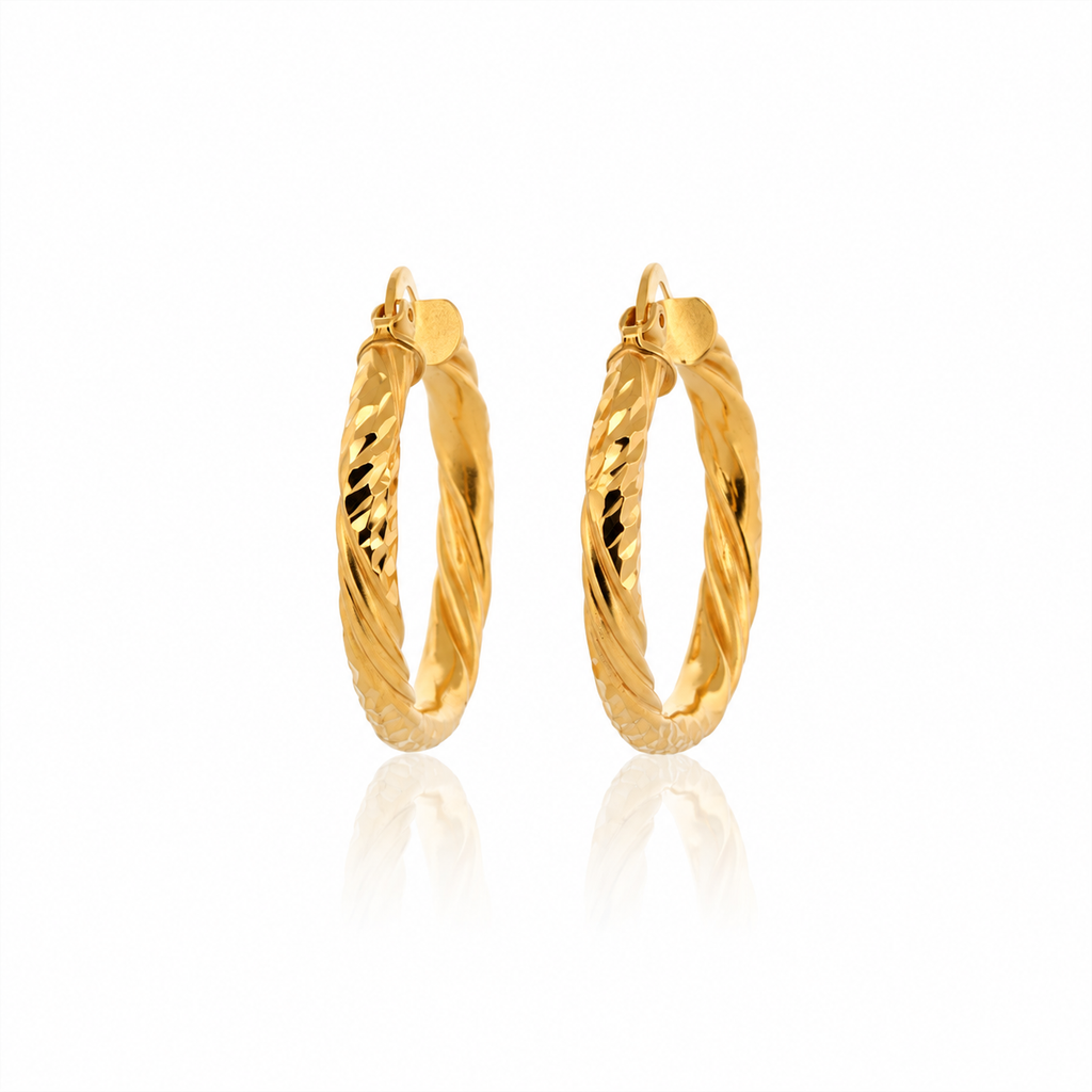 The Vela Hoops 21k yellow gold diamond cut twisted earrings